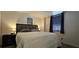 Comfortable bedroom with a cozy bed and window with blinds at 2965 Pharr Court South Nw # 316, Atlanta, GA 30305