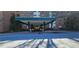Exterior shot of covered building entrance and drive with adjacent landscaping features at 2965 Pharr Court South Nw # 316, Atlanta, GA 30305