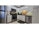 Modern kitchen features stainless steel appliances and ample counter space at 2965 Pharr Court South Nw # 316, Atlanta, GA 30305