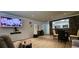 Bright living room with desk, television, and dining area adjacent to kitchen at 2965 Pharr Court South Nw # 316, Atlanta, GA 30305