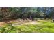 Community picnic area featuring stone tables and benches, and a grill, perfect for outdoor gatherings and barbecues at 2965 Pharr Court South Nw # 316, Atlanta, GA 30305