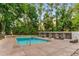 Inviting community swimming pool with lounge chairs and shaded seating areas surrounded by mature trees at 2965 Pharr Court South Nw # 316, Atlanta, GA 30305