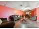 Cozy basement featuring a large entertainment center, dark sofas, and wood flooring at 760 Josh Ln, Lawrenceville, GA 30045