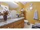 Bright bathroom featuring a granite-topped vanity, white fixtures and playful decor at 760 Josh Ln, Lawrenceville, GA 30045