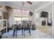 Bright breakfast nook with marble floors and view into living room with a fireplace at 760 Josh Ln, Lawrenceville, GA 30045