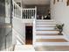 Inviting foyer with white staircase and light wood steps, offering a warm welcome into the home at 760 Josh Ln, Lawrenceville, GA 30045
