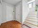 Entryway with hardwood floors, staircase, and natural light from the front door at 760 Josh Ln, Lawrenceville, GA 30045