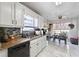Bright eat-in kitchen with granite counters, white cabinets and stainless steel dishwasher at 760 Josh Ln, Lawrenceville, GA 30045