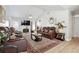 Cozy living room featuring a fireplace, ceiling fan and hardwood floors at 760 Josh Ln, Lawrenceville, GA 30045