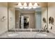 Bathroom features a double sink with granite counters and views into the bedroom and walk-in closet at 2421 Saint Davids Nw Sq, Kennesaw, GA 30152
