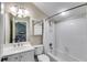 Well-lit bathroom featuring a shower-tub combo with built-in shelving at 2421 Saint Davids Nw Sq, Kennesaw, GA 30152