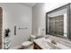Bathroom features a single sink vanity, accessible toilet, and tiled walk-in shower at 2421 Saint Davids Nw Sq, Kennesaw, GA 30152
