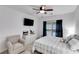 Cozy bedroom features a queen bed, large dresser, and ample natural light at 2421 Saint Davids Nw Sq, Kennesaw, GA 30152