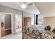 Bedroom with neutral paint, a ceiling fan, and direct access to a well appointed bathroom at 2421 Saint Davids Nw Sq, Kennesaw, GA 30152