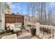 Outdoor deck with comfortable seating, planters, and wooded view at 2421 Saint Davids Nw Sq, Kennesaw, GA 30152