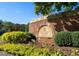 The Overlook at Hampton Golf Club entrance monument amidst lush landscaping at 2421 Saint Davids Nw Sq, Kennesaw, GA 30152