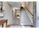 Inviting home entryway featuring a staircase with carpet and hardwood floors at 2421 Saint Davids Nw Sq, Kennesaw, GA 30152