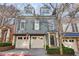 Exterior shot showcasing the home's detailed facade and attached two-car garage at 2421 Saint Davids Nw Sq, Kennesaw, GA 30152