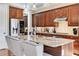 Gourmet kitchen island with granite countertops and stainless steel appliances at 2421 Saint Davids Nw Sq, Kennesaw, GA 30152