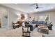 Living room features a large sectional sofa, plush carpeting, and stylish decor at 2421 Saint Davids Nw Sq, Kennesaw, GA 30152