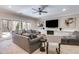 Comfortable living room with neutral tones, large windows, and ample seating at 2421 Saint Davids Nw Sq, Kennesaw, GA 30152