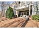 Covered patio with furniture provides view into the home and to the backyard at 2421 Saint Davids Nw Sq, Kennesaw, GA 30152