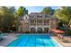 Beautiful community pool with ample seating and a well-maintained pool house at 2421 Saint Davids Nw Sq, Kennesaw, GA 30152