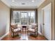 Cozy sitting room with hardwood floors, comfortable chairs, and a bright window view at 2421 Saint Davids Nw Sq, Kennesaw, GA 30152