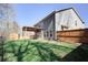 Spacious backyard featuring a covered patio and a wooden privacy fence at 3480 Buffington Ln, Cumming, GA 30040