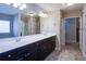 This elegant bathroom includes dual sinks, a glass shower and plenty of cabinet space at 3480 Buffington Ln, Cumming, GA 30040