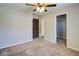 This spacious bedroom has neutral walls and carpet with a ceiling fan and walk-in closet at 3480 Buffington Ln, Cumming, GA 30040