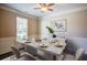 Elegant dining room with a marble-topped table, stylish decor, and a large window at 3480 Buffington Ln, Cumming, GA 30040