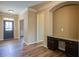 Welcoming entryway with hardwood floors, a built-in desk, and a view into other rooms at 3480 Buffington Ln, Cumming, GA 30040