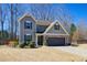 Charming two-story home featuring stone accents and a two-car garage at 3480 Buffington Ln, Cumming, GA 30040
