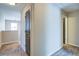 Bright hallway with neutral colored walls and carpeted floors and a window at 3480 Buffington Ln, Cumming, GA 30040