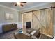 Bright home office with a rustic barn door, modern desk, and stylish storage at 3480 Buffington Ln, Cumming, GA 30040