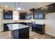 Features a kitchen with dark cabinetry, stainless steel appliances, and granite countertops at 3480 Buffington Ln, Cumming, GA 30040