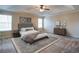 This bedroom features recessed lighting, a ceiling fan and large windows with a comfortable queen bed at 3480 Buffington Ln, Cumming, GA 30040