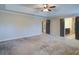 This expansive main bedroom features recessed lighting and multiple doors at 3480 Buffington Ln, Cumming, GA 30040