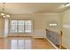 Open dining space featuring hardwood floors, a chandelier, and natural light at 6046 China Rose Ln, Duluth, GA 30097