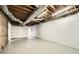 Unfinished basement area with exposed ceiling, wrapped ductwork, and concrete flooring at 4279 Castle Pines Ct, Tucker, GA 30084