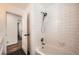 Updated bathroom with subway tile in shower and hexagon tile flooring at 4279 Castle Pines Ct, Tucker, GA 30084