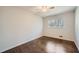 Bedroom with hardwood floors, ceiling fan, window, and neutral wall color at 4279 Castle Pines Ct, Tucker, GA 30084