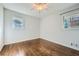 Bedroom featuring hardwood floors, ceiling fan, and lots of natural light at 4279 Castle Pines Ct, Tucker, GA 30084