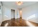 Bedroom with hardwood floors, closet with sliding doors, and ceiling fan at 4279 Castle Pines Ct, Tucker, GA 30084