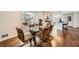 Dining area flows into kitchen, featuring sleek modern design and sun-drenched breakfast nook at 4279 Castle Pines Ct, Tucker, GA 30084