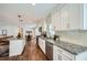 Well-lit kitchen featuring granite countertops, stainless appliances, and hardwood floors at 4279 Castle Pines Ct, Tucker, GA 30084