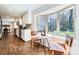 Bright kitchen with a breakfast nook by bay window, stainless steel appliances, and wood floors at 4279 Castle Pines Ct, Tucker, GA 30084