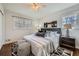 Calm bedroom with a large bed, unique area rug, and natural light at 4279 Castle Pines Ct, Tucker, GA 30084