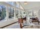 Bright sunroom with vaulted ceilings, many windows, and views of the backyard at 4279 Castle Pines Ct, Tucker, GA 30084